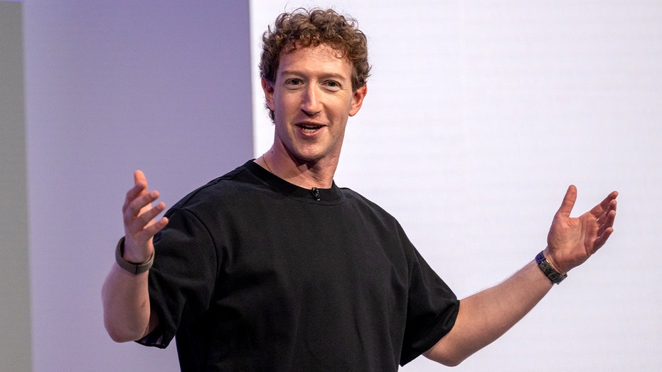 Meta CEO Mark Zuckerberg stands on stage presenting new hardware during a company event.