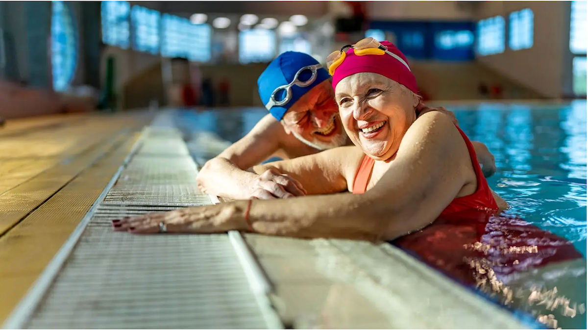 Older couple swimming