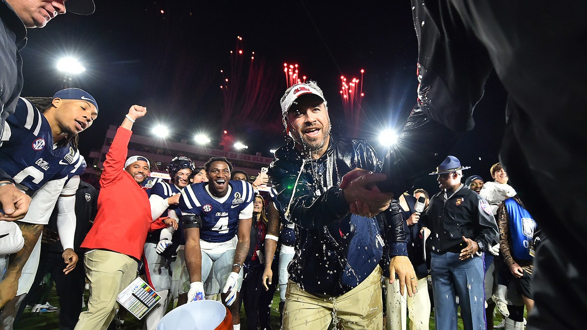 Pete Golding and Ole Miss players celebrate