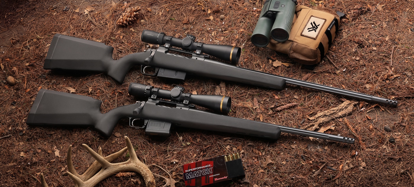 short action and long action versions of the Springfield Armory Model 2020 Waypoint with SG-100 Cerakote finish rifles next to each other