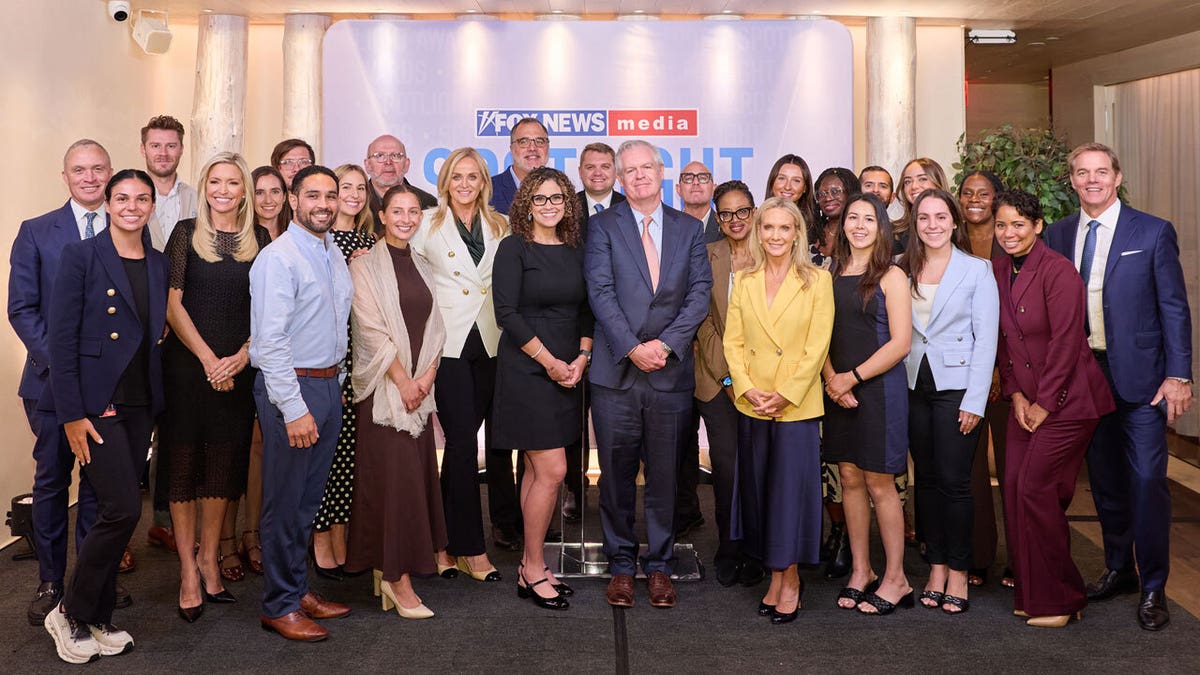 FOX News Media CEO Suzanne Scott and FOX News Media President and Executive Editor Jay Wallace with the Spotlight Award winners.