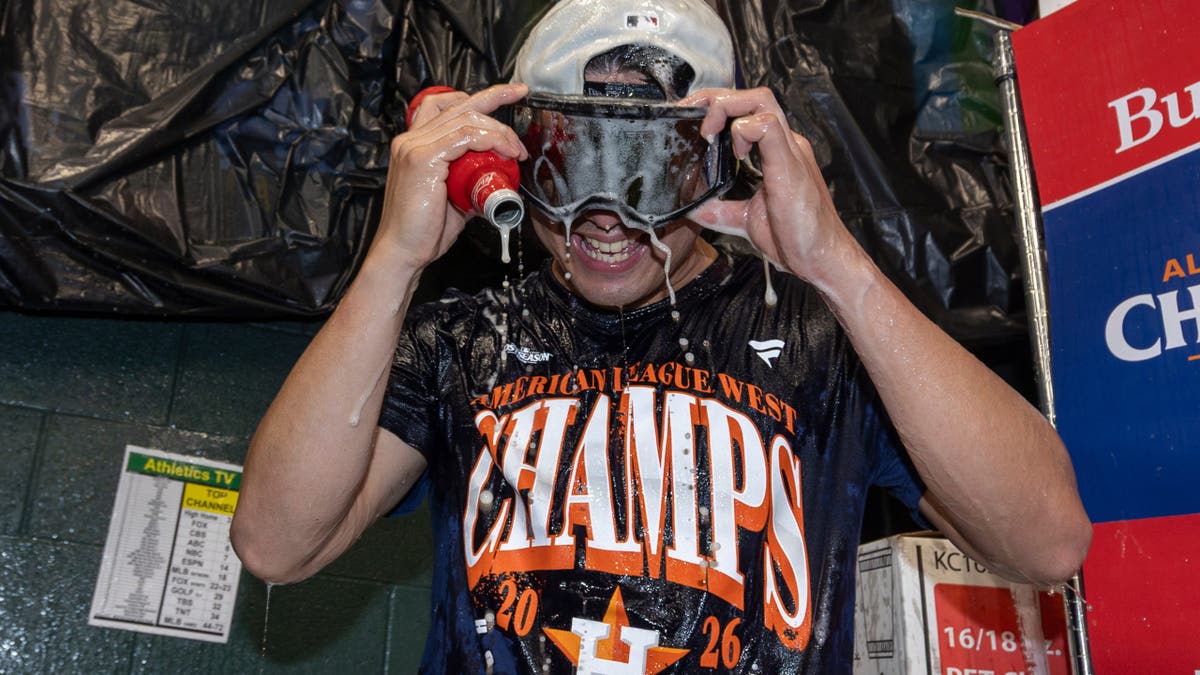 Tatsuya Imai celebrates after clinching the AL West division title.
