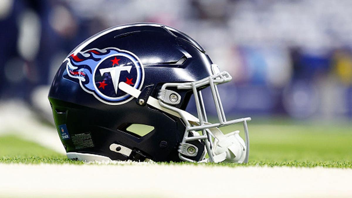 Tennessee Titans helmet sits on the turf at Lucas Oil Stadium.
