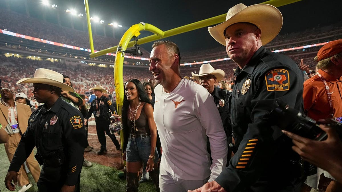 Steve Sarkisian, Texas Longhorns head coach, leaves the field following the NCAA football game against Ohio State.
