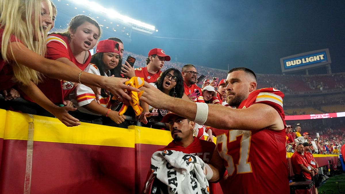 Travis Kelce heads to the locker room after an NFL game.