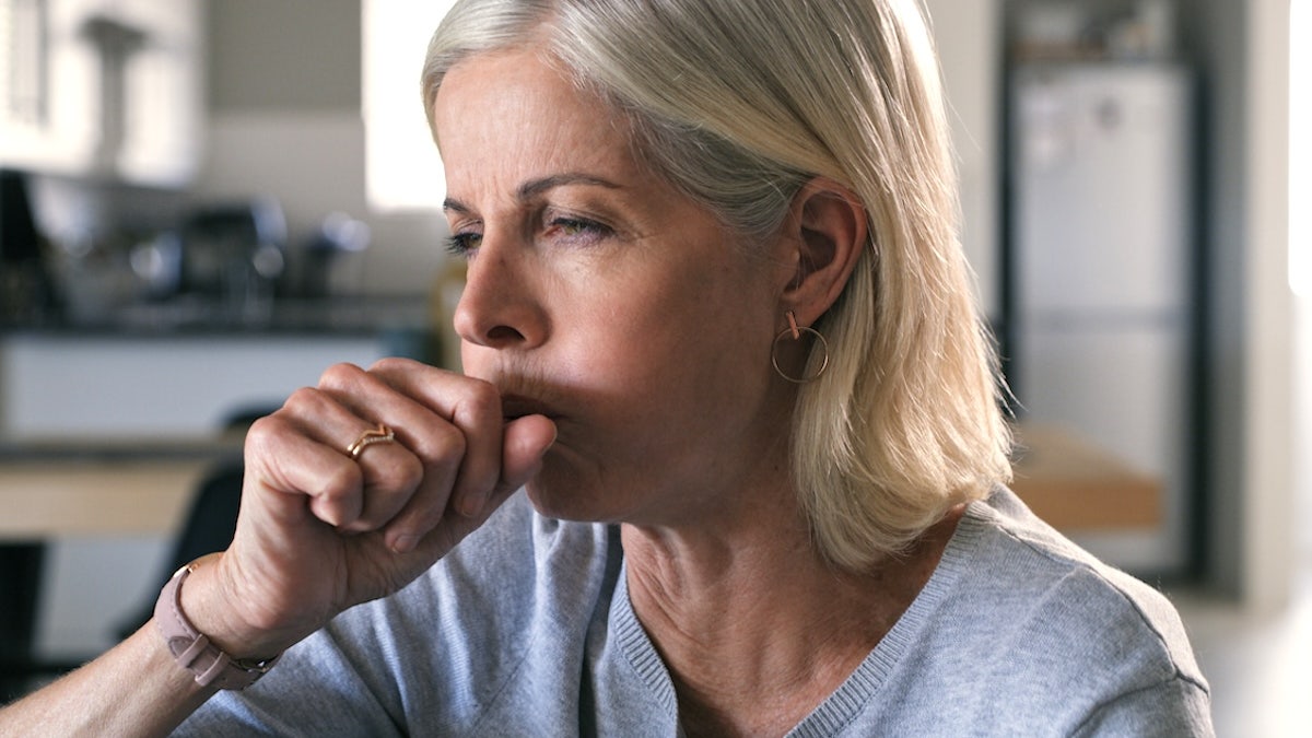 Woman coughing
