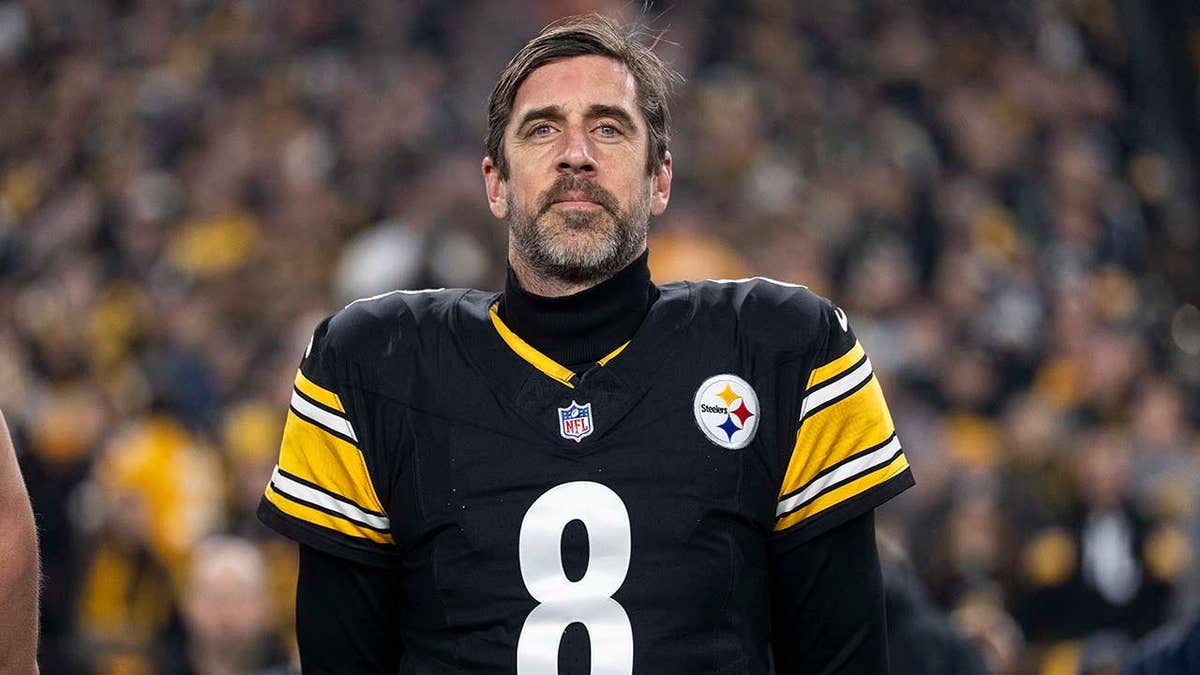 Aaron Rodgers looking on before an NFL game kicks off