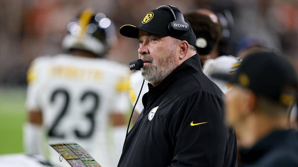 Mike McCarthy looking on during an NFL game