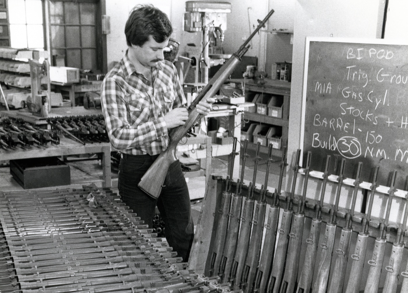 Springfield Armory CEO and owner Dennis Reese inspecting M1A rifles
