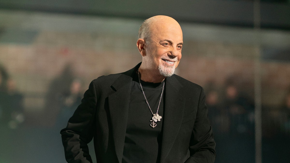 Billy Joel smiles in a photo