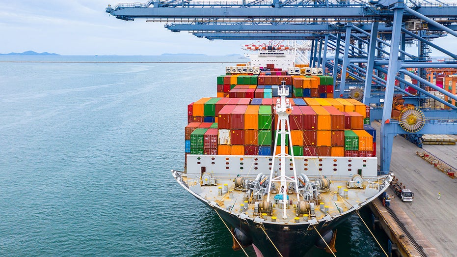 Loaded cargo ship in the water.