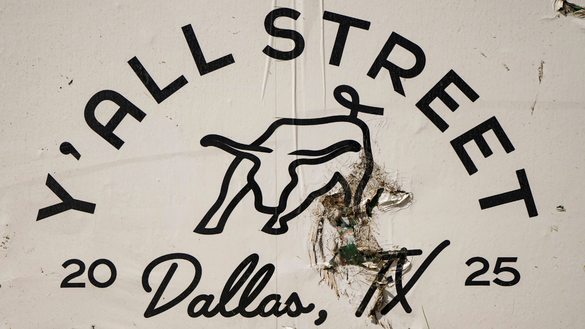 Y'all Street signage surrounding the Goldman Sachs campus under construction in downtown Dallas, Texas.