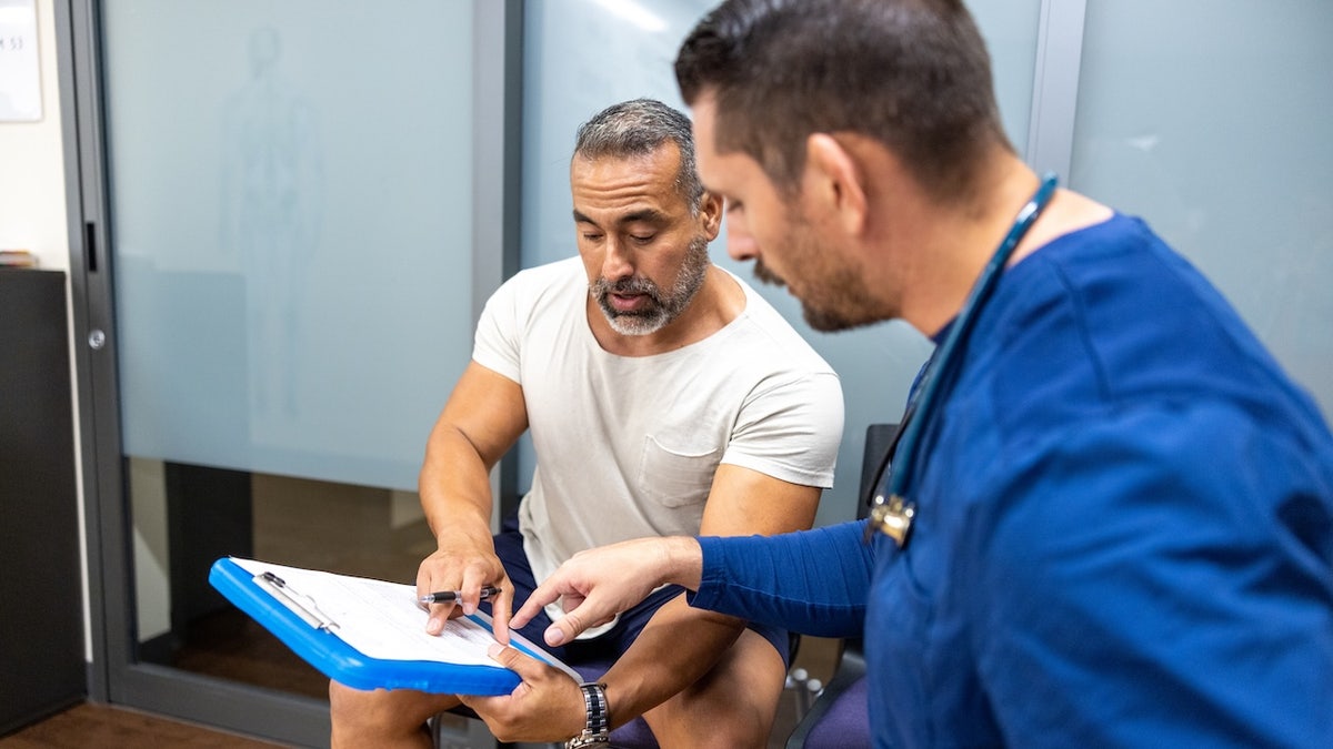 Fit man at doctor