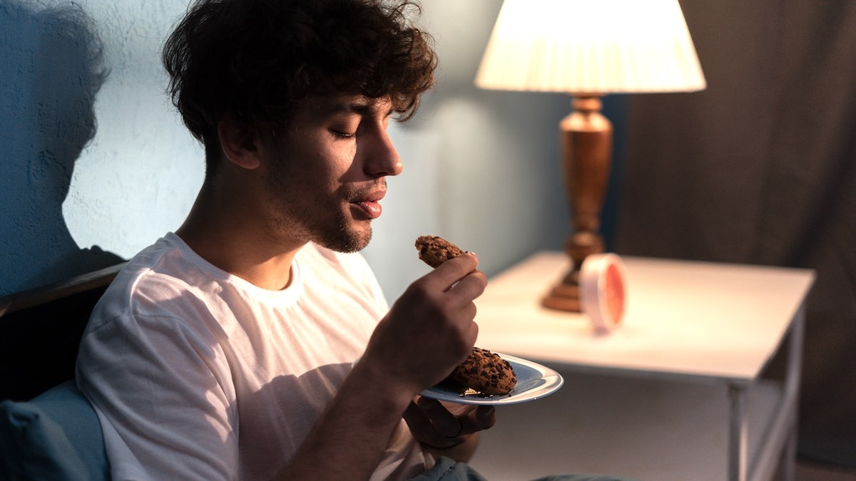Man eating at night