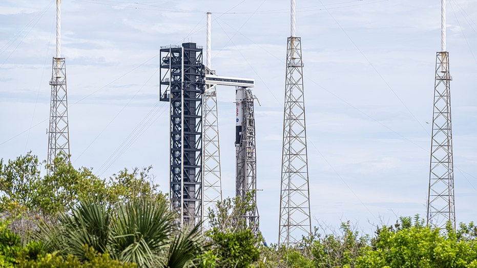 SpaceX rocket and spacecraft on launch pad before departure